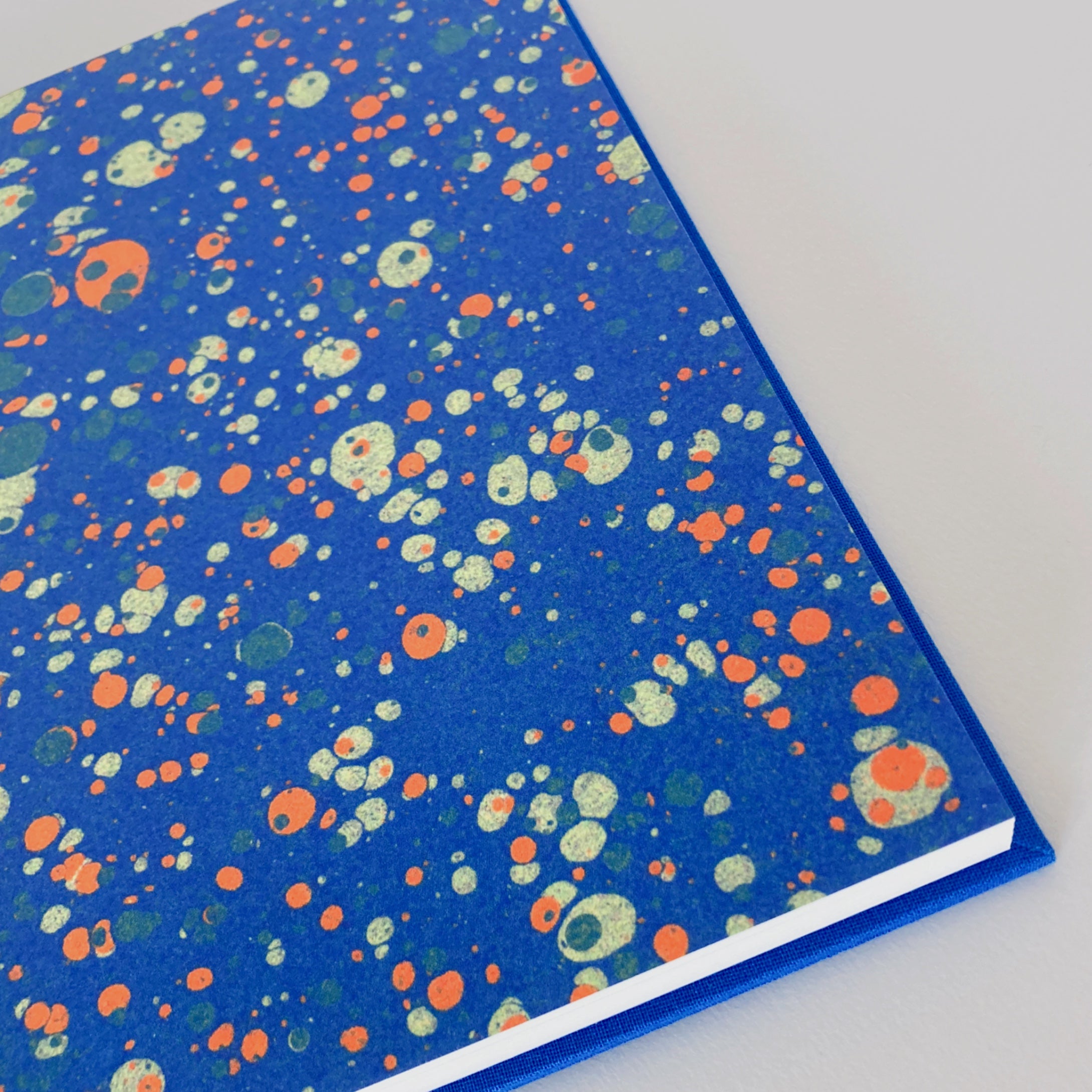 Blue, mint and orange marble end pages.